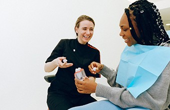 Dentist discussing dental crown with patient